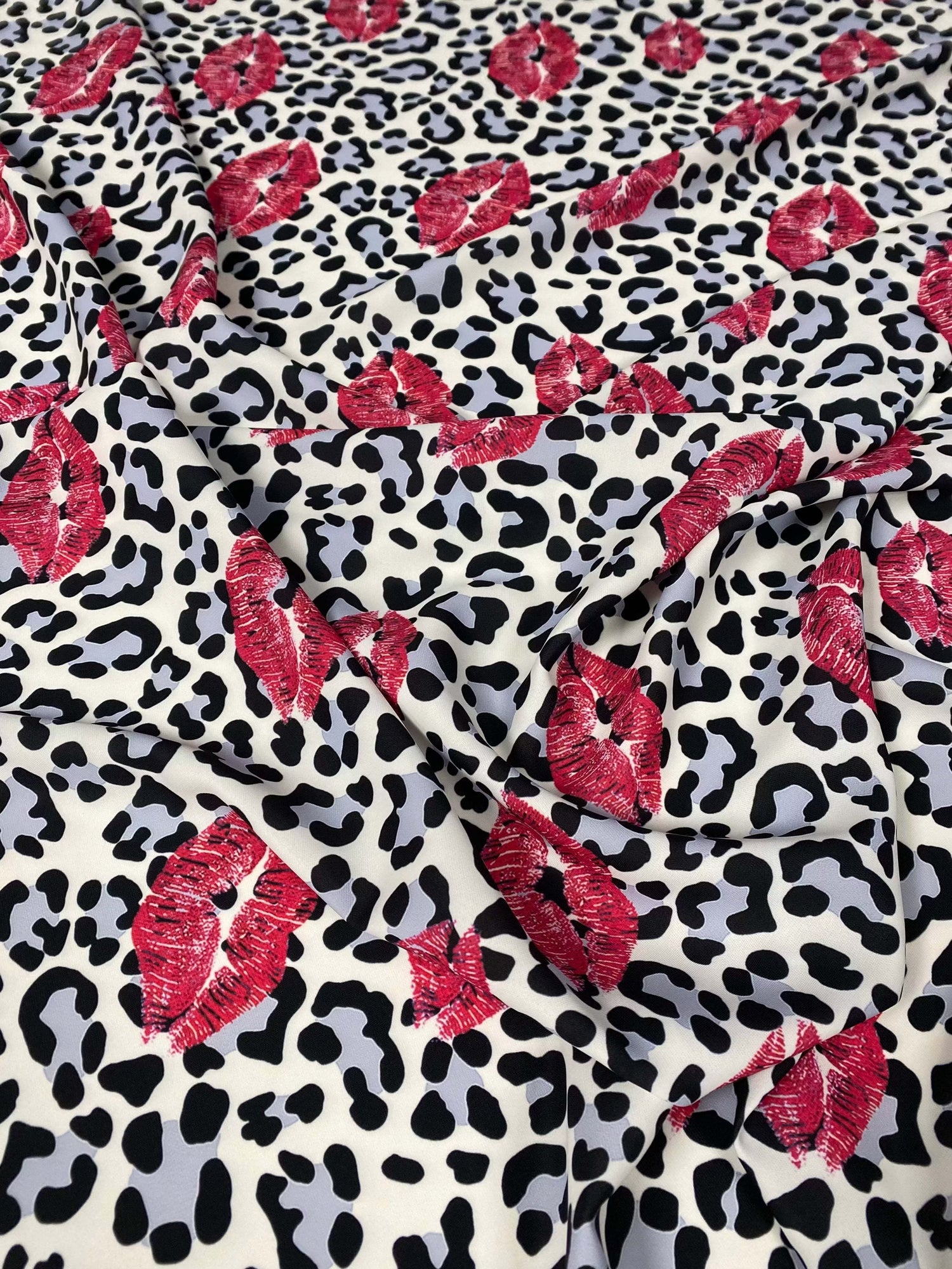 Leopard print fabric with red pink lip pattern for upholstery and home decor projects