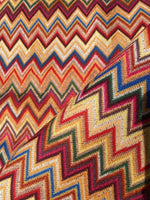 Colorful zigzag chevron upholstery fabric with vibrant digital print, ideal for outdoor use and upholstery projects.