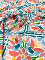 Colorful mosaic floral fabric with pink, blue, green, and yellow geometric flower pattern, 150cm wide, ideal for sewing and crafting projects