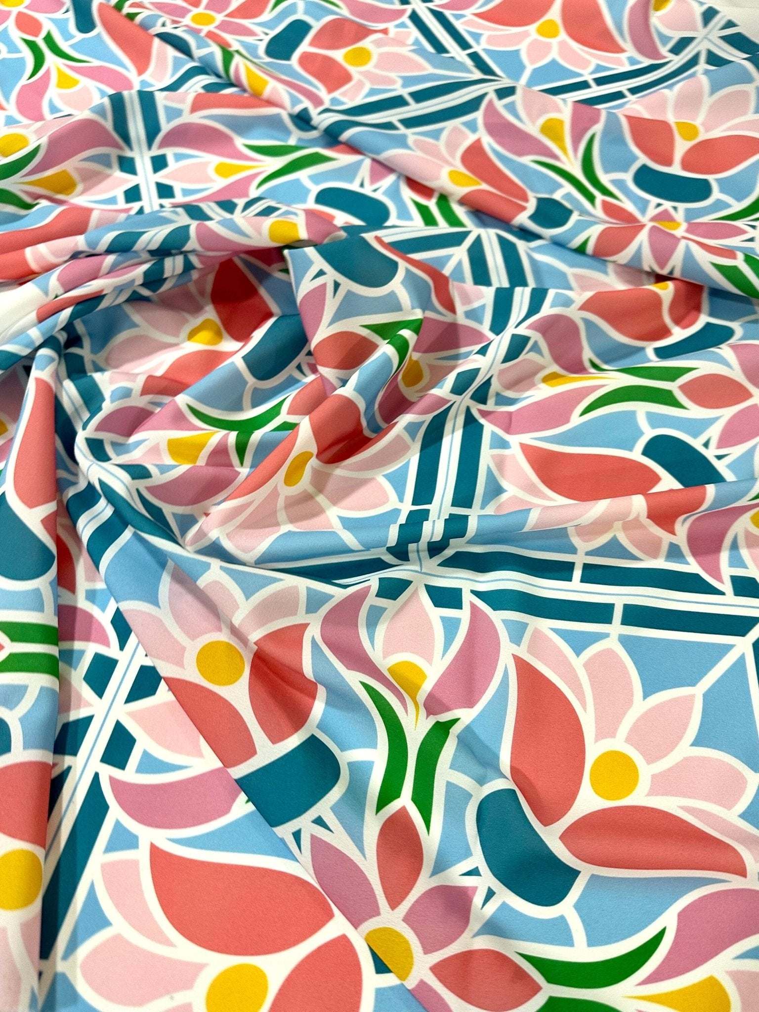 Colorful mosaic floral fabric with pink, blue, green, and yellow geometric flower pattern, 150cm wide, ideal for sewing and crafting projects