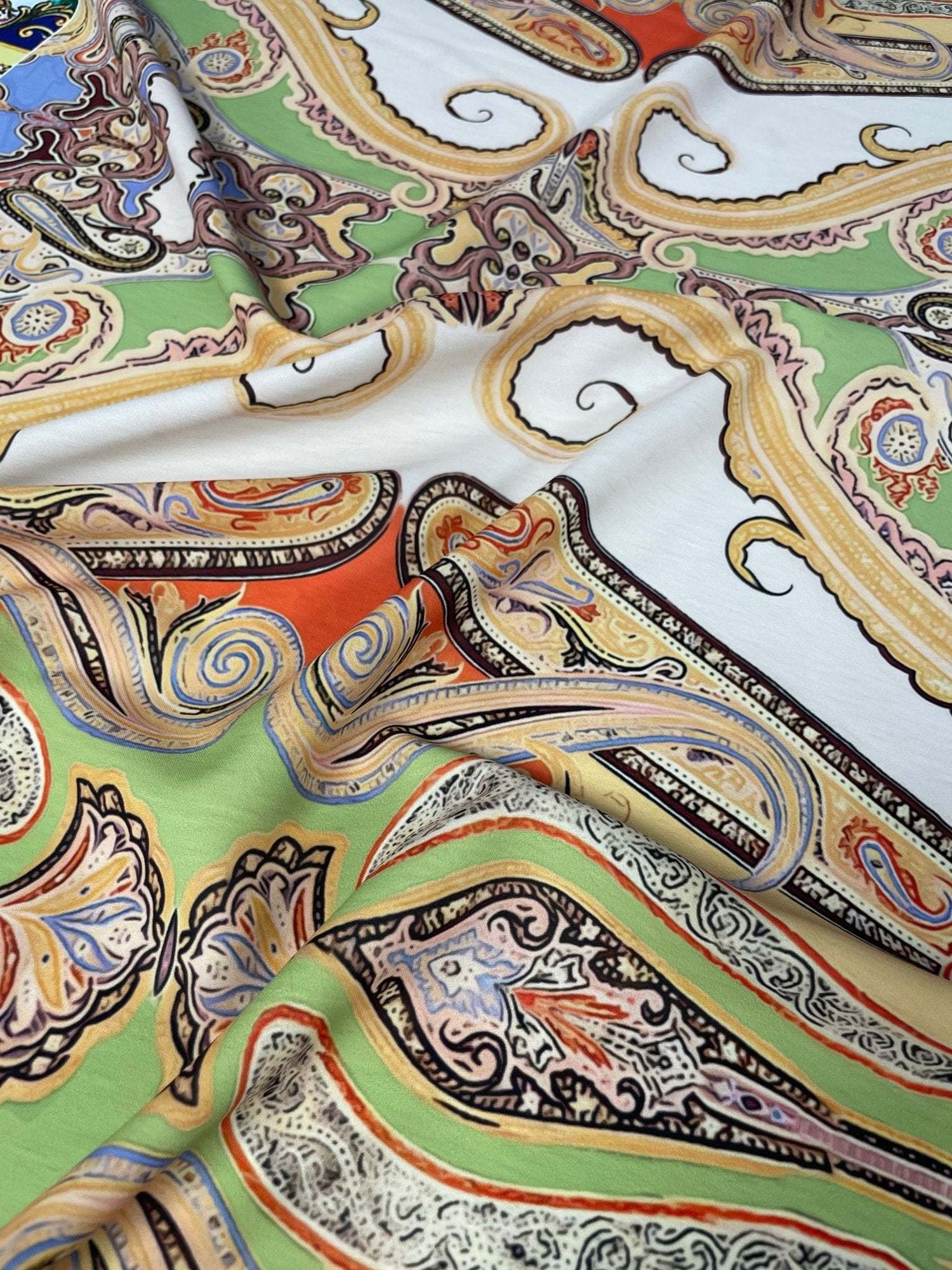 Multicolor vintage bohemian textile fabric with ornate paisley and Baroque details in vibrant colors