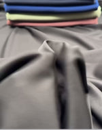 Cotton Modal Fabric by the Metre – Ultra-Soft Breathable Knit for Clothing displayed in various colors.