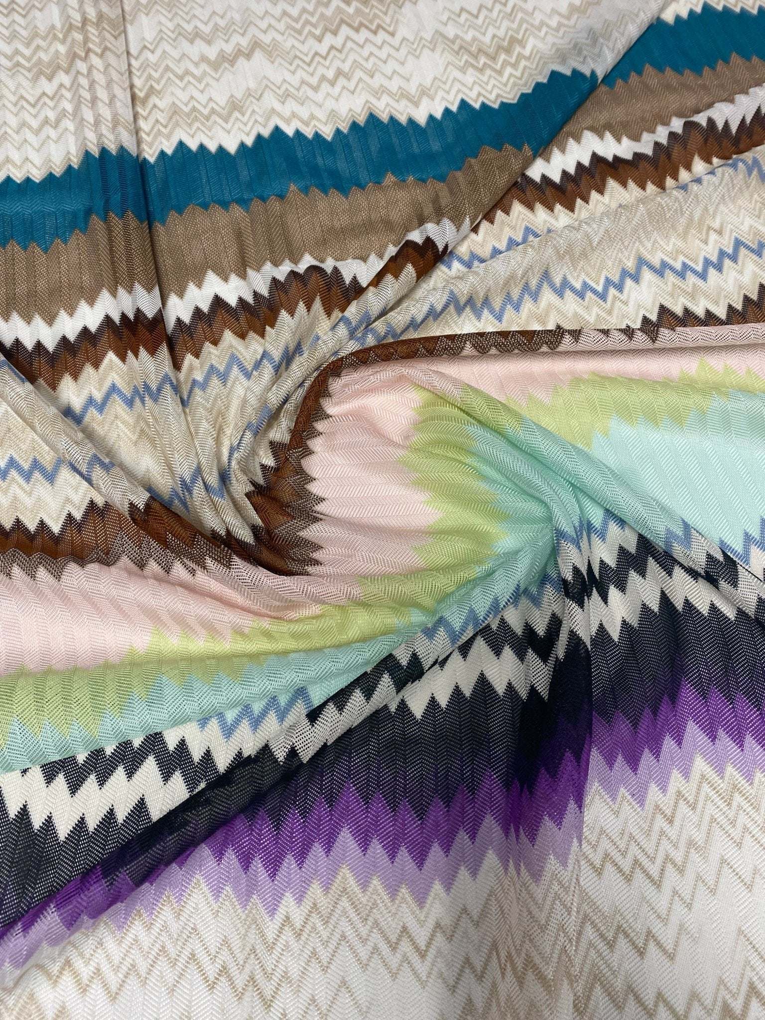 Colorful zigzag mesh fabric with breathable, durable woven texture ideal for crafting and upholstery projects
